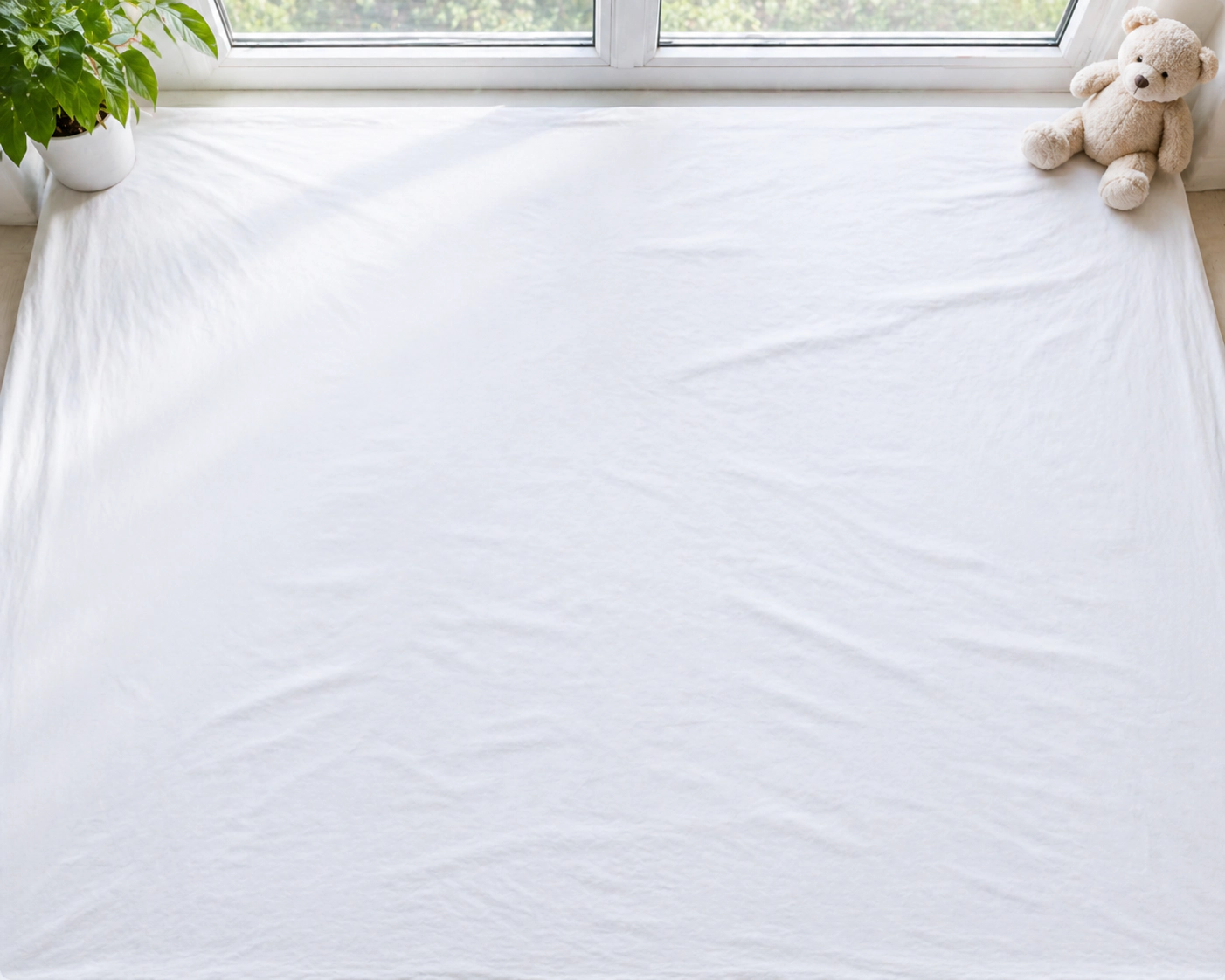 Step 1: Set up plain white sheet background with natural lighting
